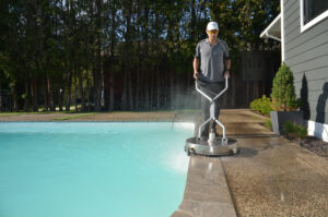 A.D.S. Expert, cleaning exposed aggregate concrete pool patio.